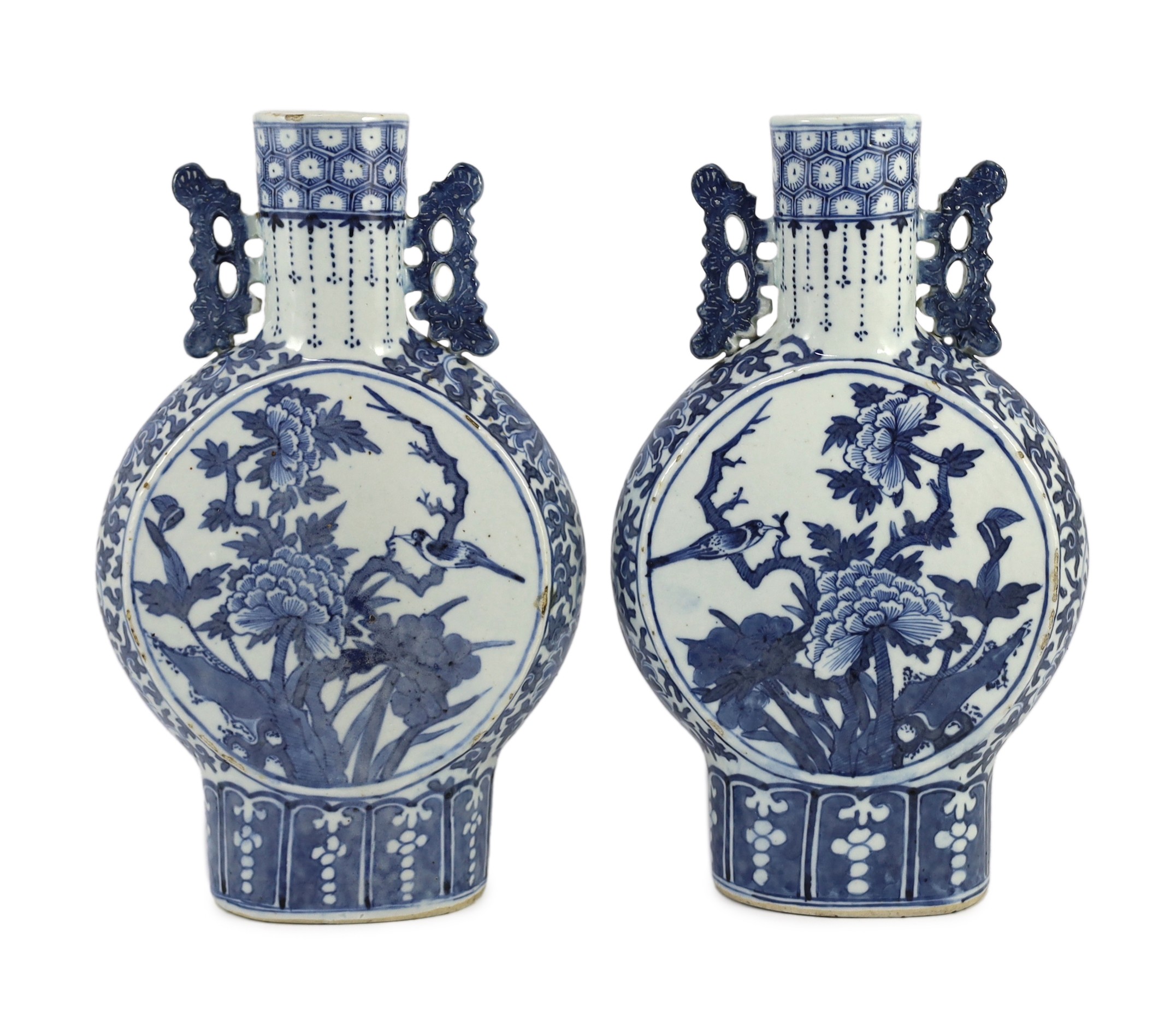 A pair of Chinese blue and white moon flasks, 19th century, 30cm high, small glaze losses and firing cracks
